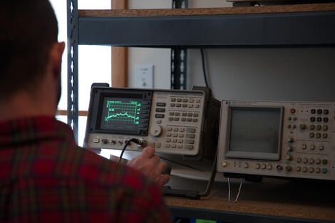 Person using EMC testing equipment